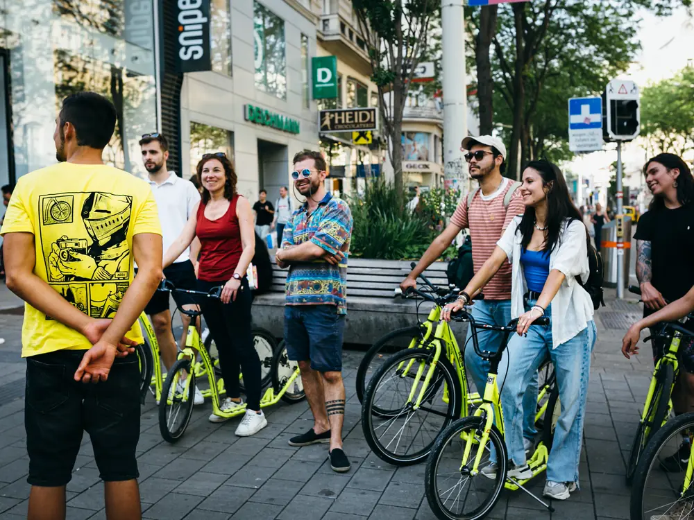 Team on an e-scooter tour with a Prime Tours guide in Vienna